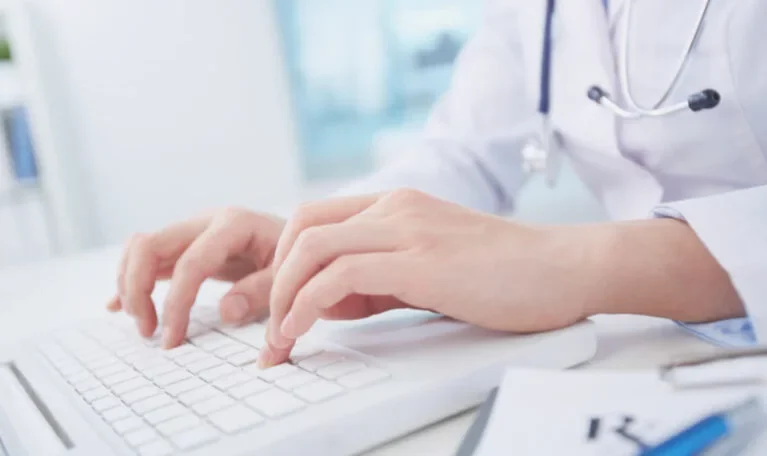 A Medical Practitioner is using laptop to determine importance of Medical Billing Data