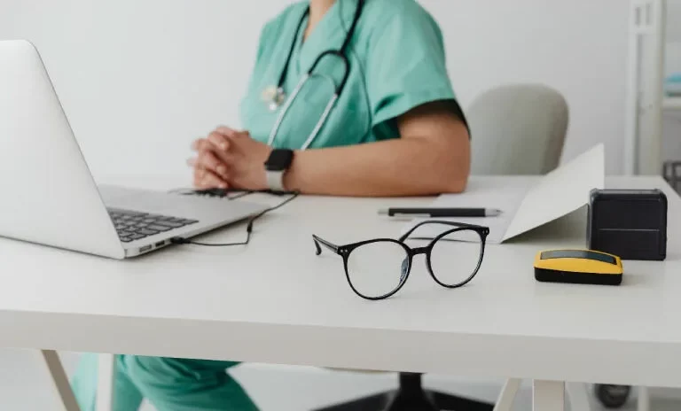 The-Importance-of-Compliance-in-Medical-Billing-image-1-768x507x0x27x768x464x1699280995 A doctor is researching on a laptop about the importance of compliance in medical billing