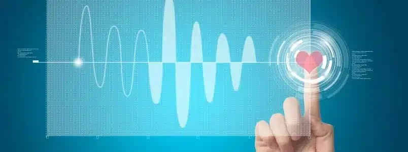 The Rise Of Value Based Care In Cardiology Current Trends And Methods A hand pressing a heart icon on a touchscreen, symbolizing love or approval.